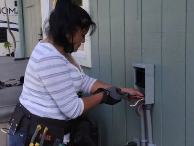 Licensed electrician wiring an exterior subpanel in Arbutus